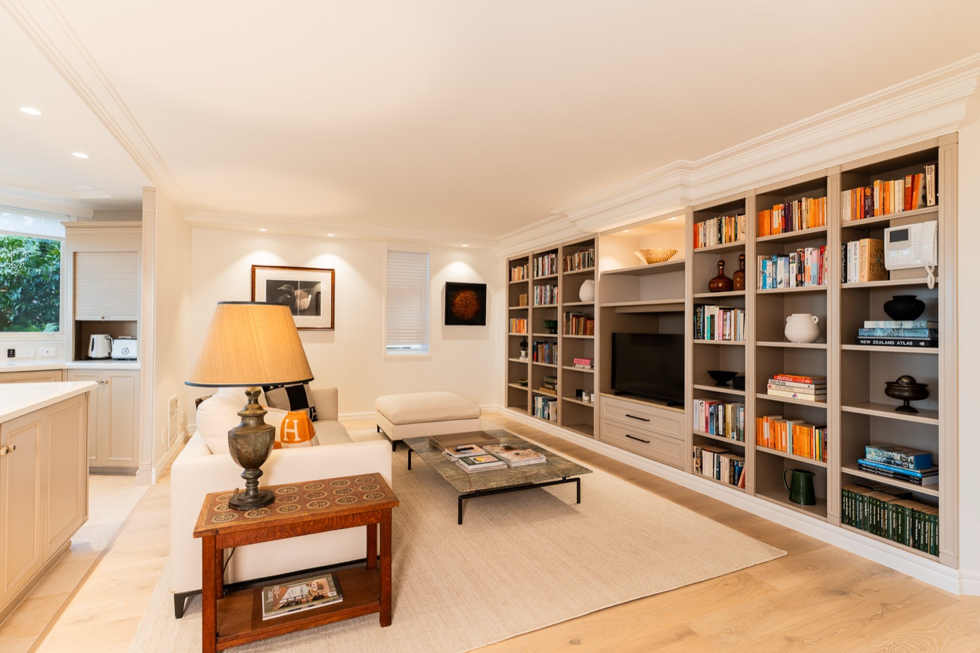 Living room with new full-height joinery and library wall