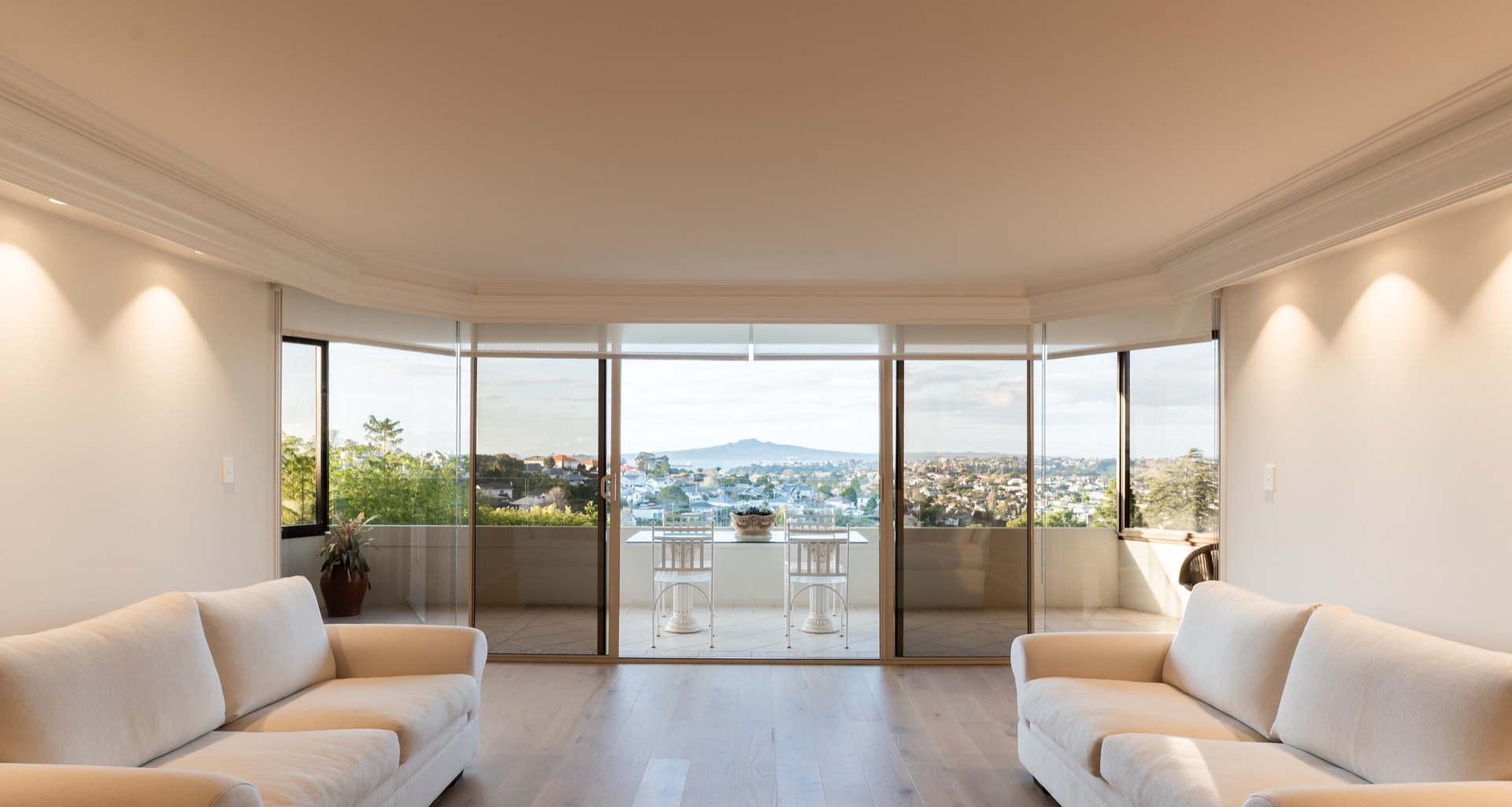 Renovated Remuera living room opening to Rangitoto views